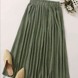 Like new elastic waist green midi skirt with with black dot pattern
